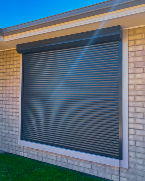 Close-up view of a modern and secure roller shutter installed on a window for enhanced privacy and security.