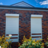 Close-up view of a modern and secure roller shutter installed on a window for enhanced privacy and security.