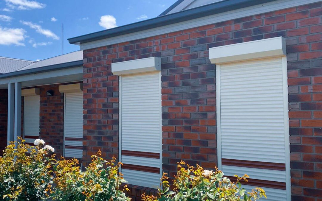 DIY roller shutters on two slender windows, combining security and style.