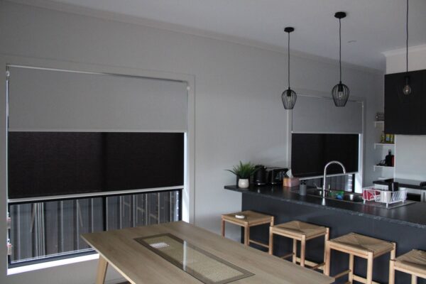 Dual Roller Blinds installed on a window, offering enhanced safety and privacy.