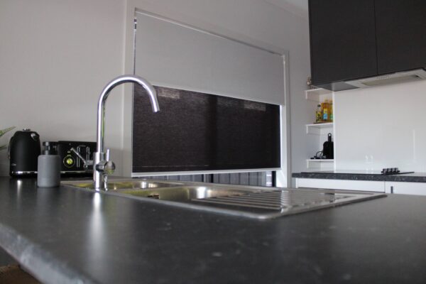 Close shot from a Dual Roller Blind installed in a kitchen