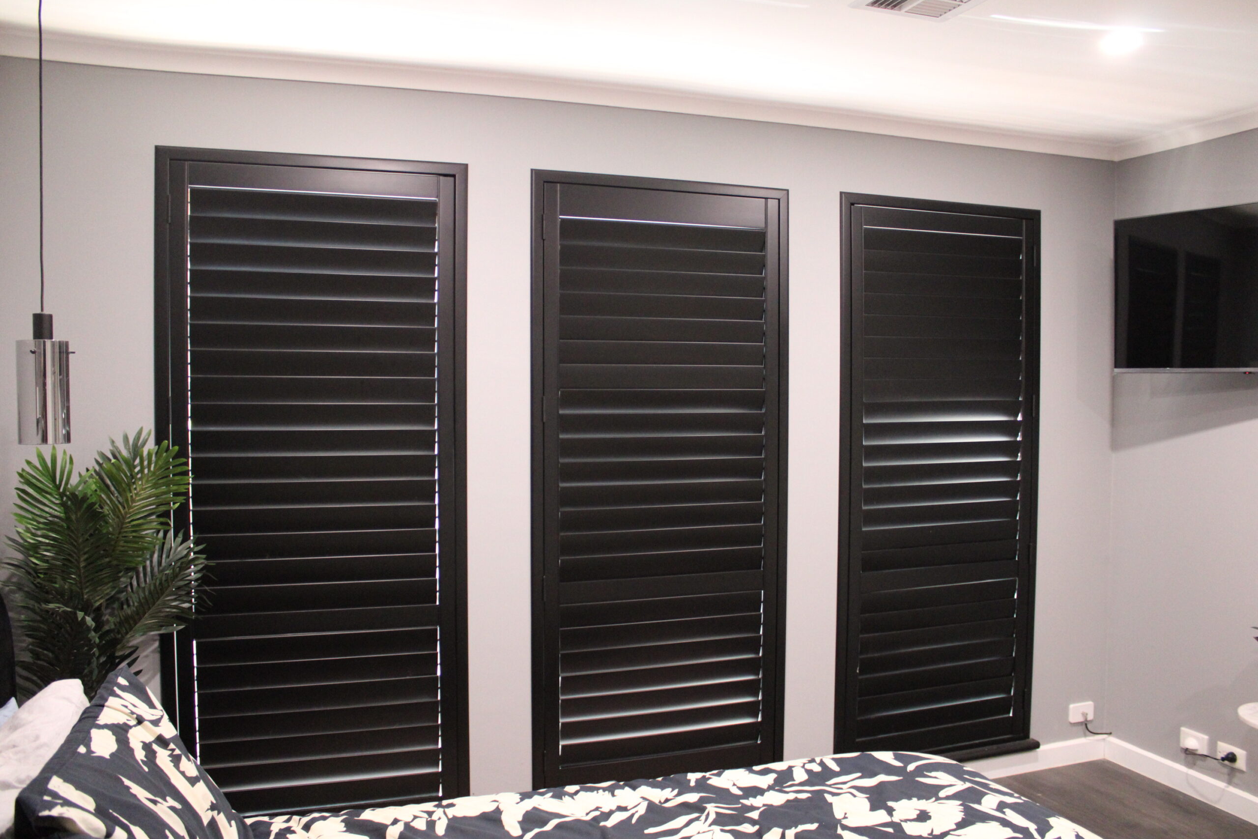 Black plantation shutters closed